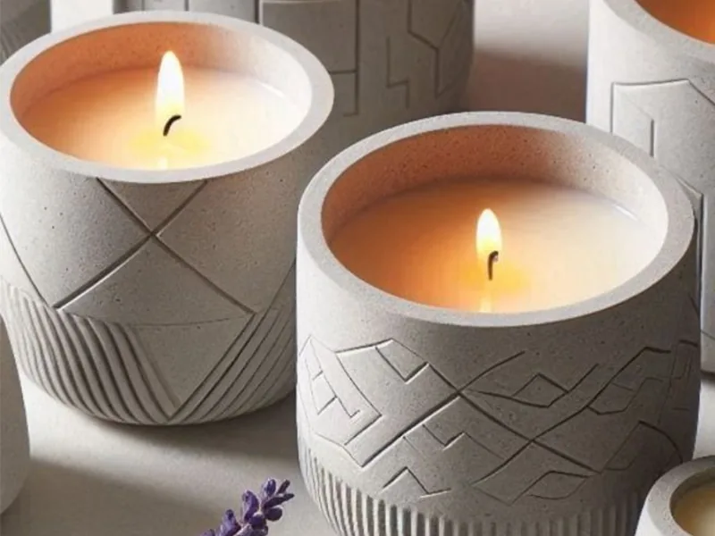Velas em potes de concreto com relevo geométrico